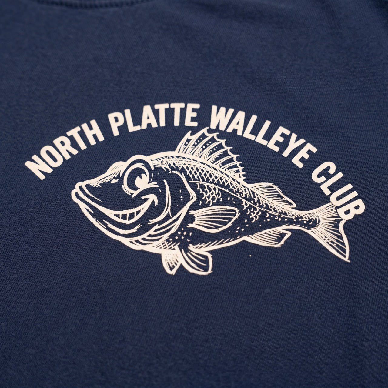 Navy blue shirt with white fish graphic and 'North Platte Walleye Club' text